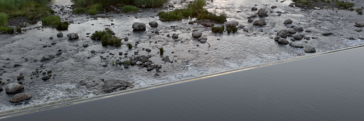 Still image of Brewarrina fish traps and weir on Ngemba Country, from ‘Overflow’ film, 2026. Photo: Ivan Sen